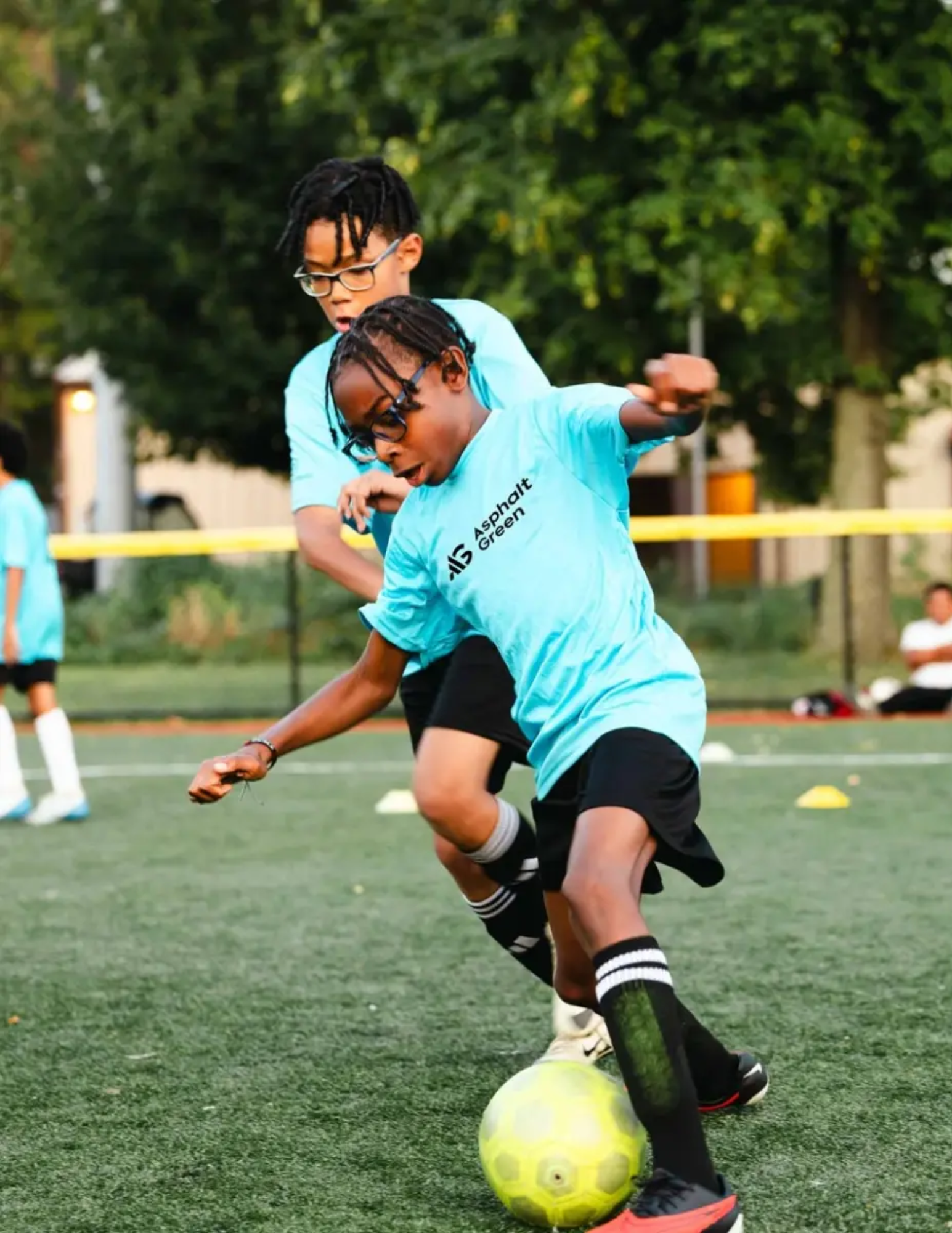 Kids playing soccer at Asphalt Green